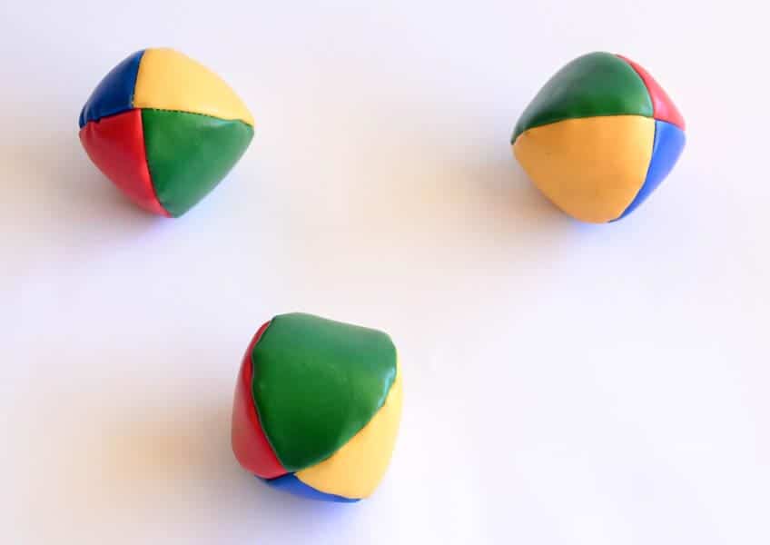 Overhead view of three multi-coloured juggling balls. Kate Crocker Adelaide Copywriter Portfolio page