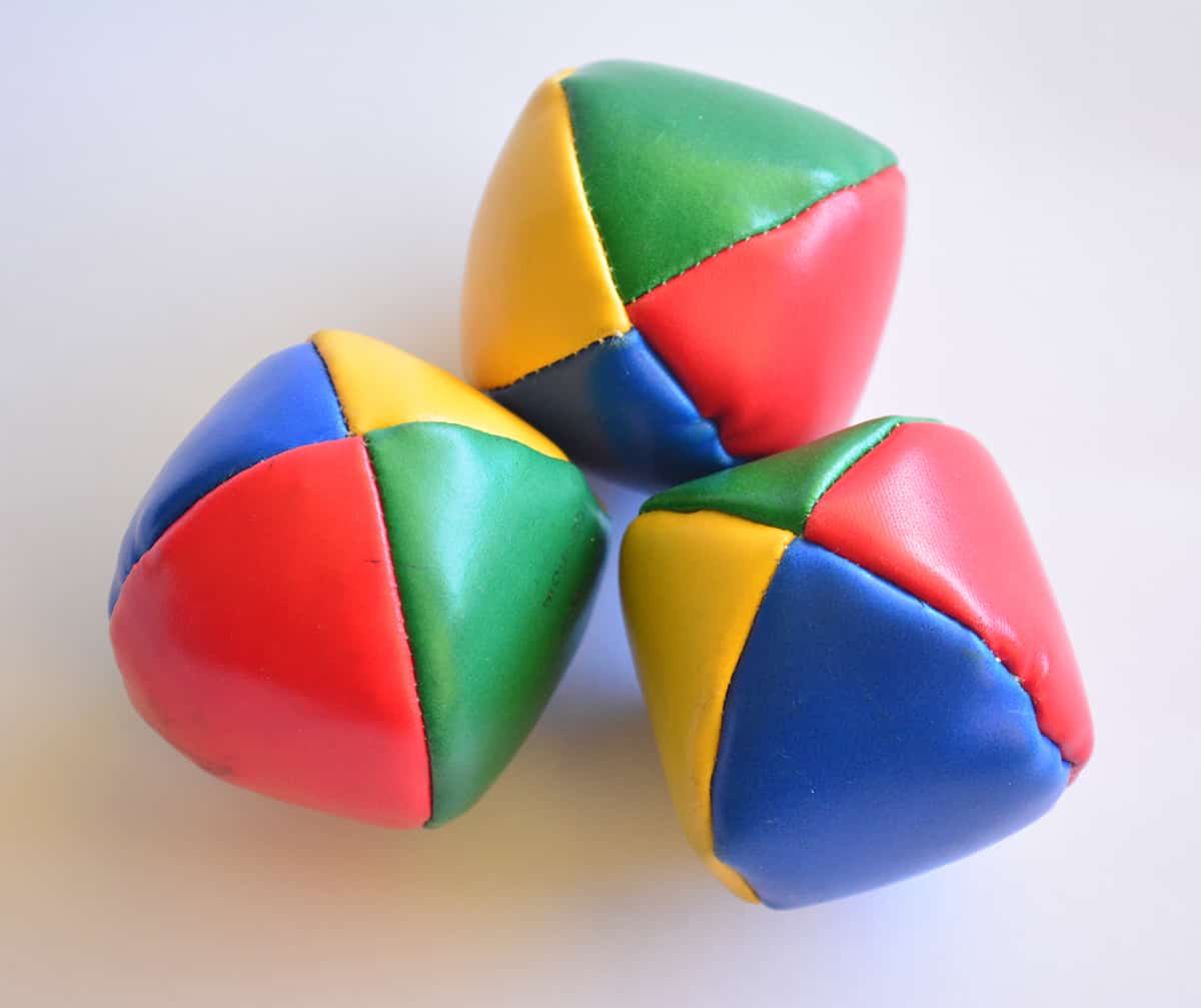 Overhead view of three juggling balls