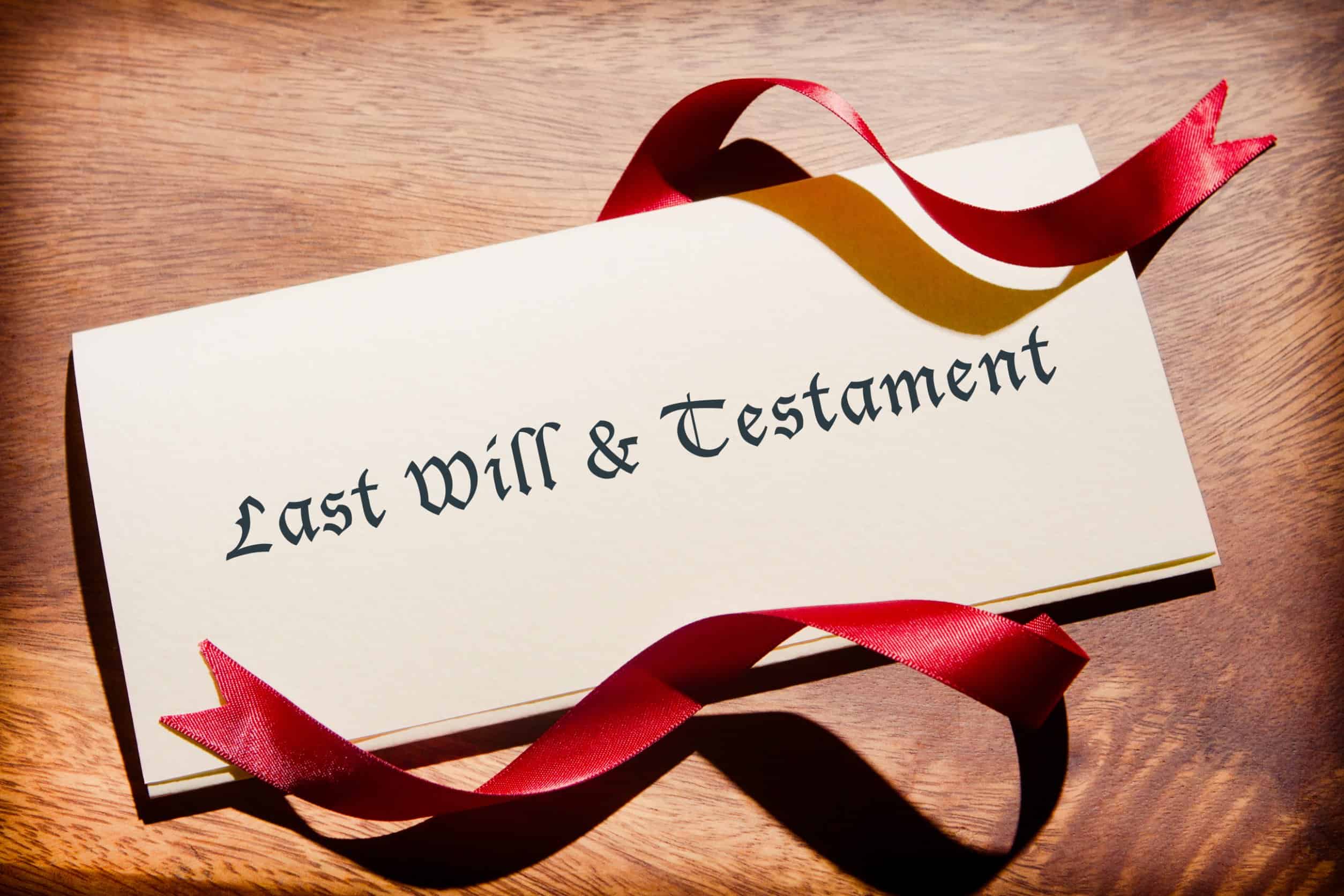 Overhead view of last will and testament document, with red ribbon