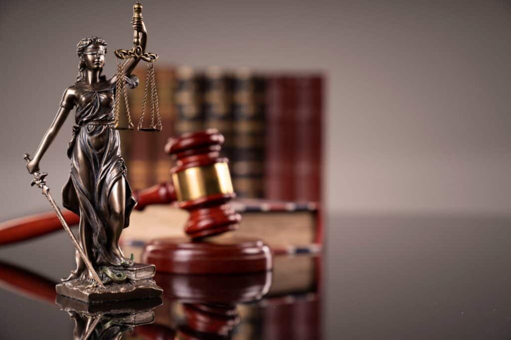 Legal symbols that are often included in photos for law firm websites include scales, lady justice, gavel and law books