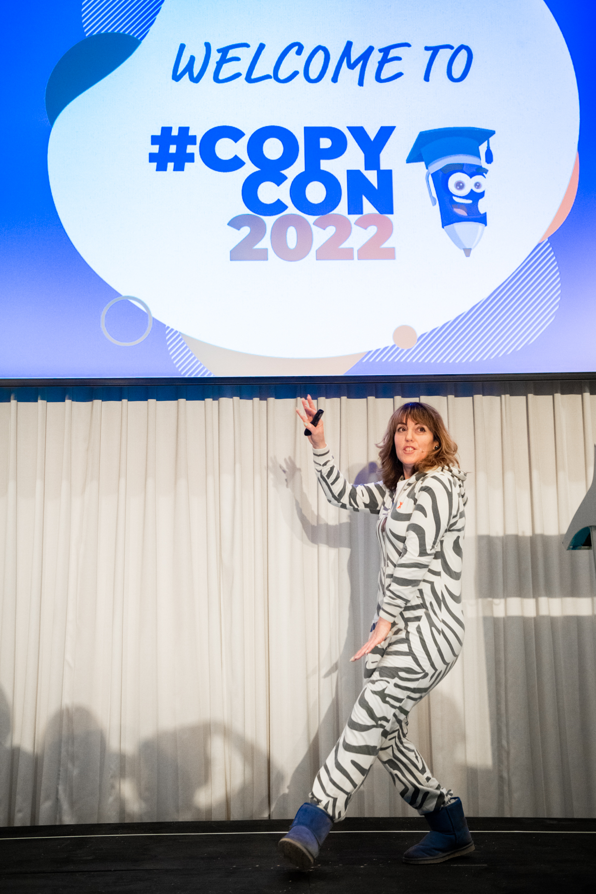 Kate Toon in a zebra onesie and ugg boots at CopyCon2022